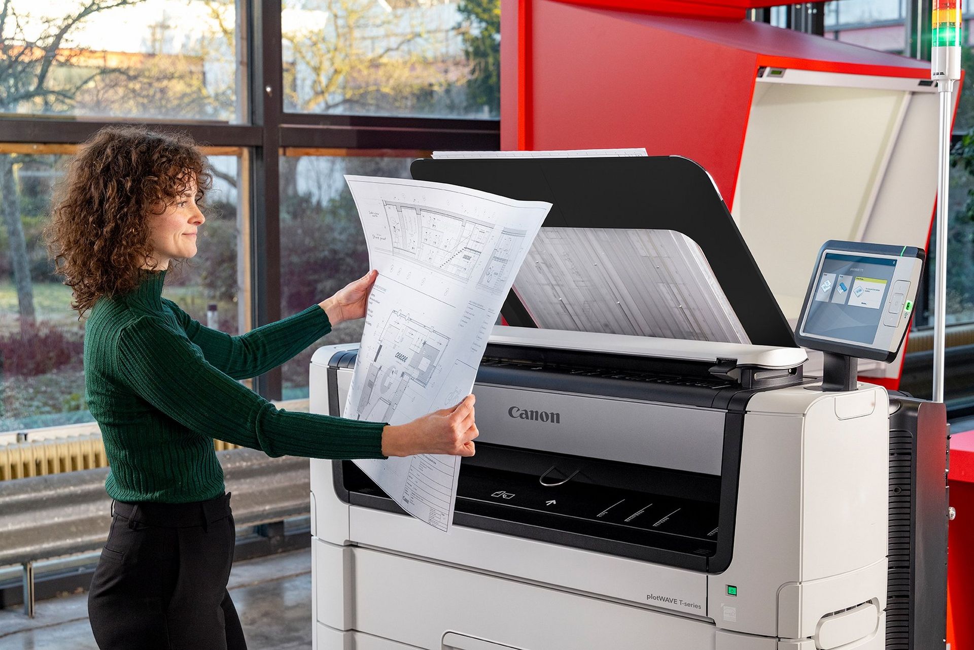 Canon PlotWave T-series in an office with blueprints